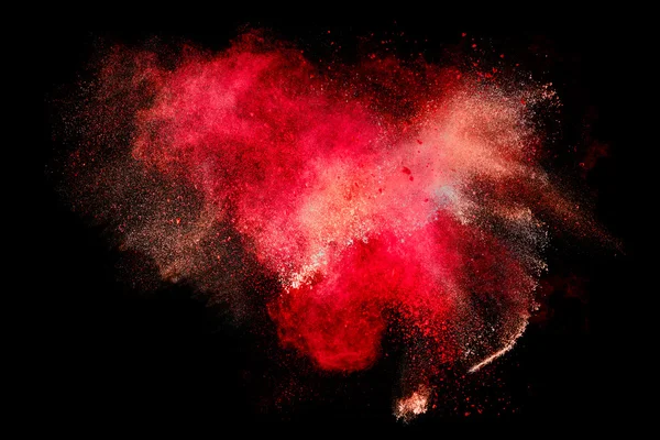 Bunte Staubpartikelexplosion isoliert auf schwarzem Hintergrund — Stockfoto