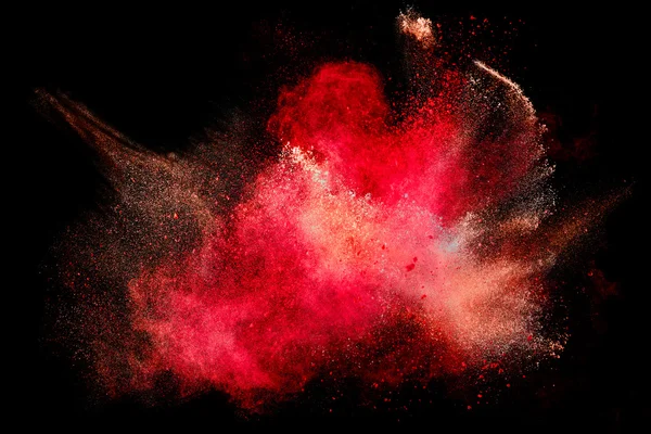 Explosión colorida de partículas de polvo aislada en negro —  Fotos de Stock