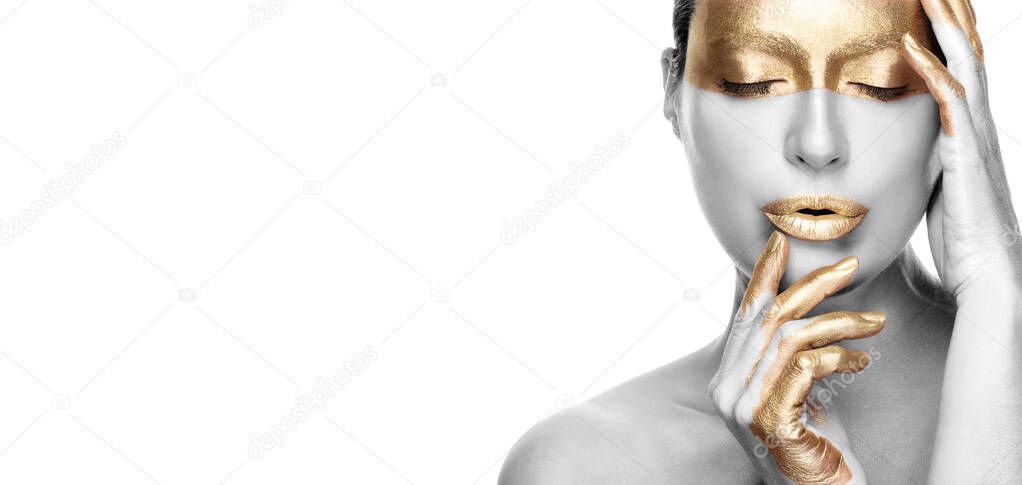 Gold based anti aging skincare concept. Beautiful model woman with gold treatment posing with closed eyes and a serene expression. Close up beauty portrait on white