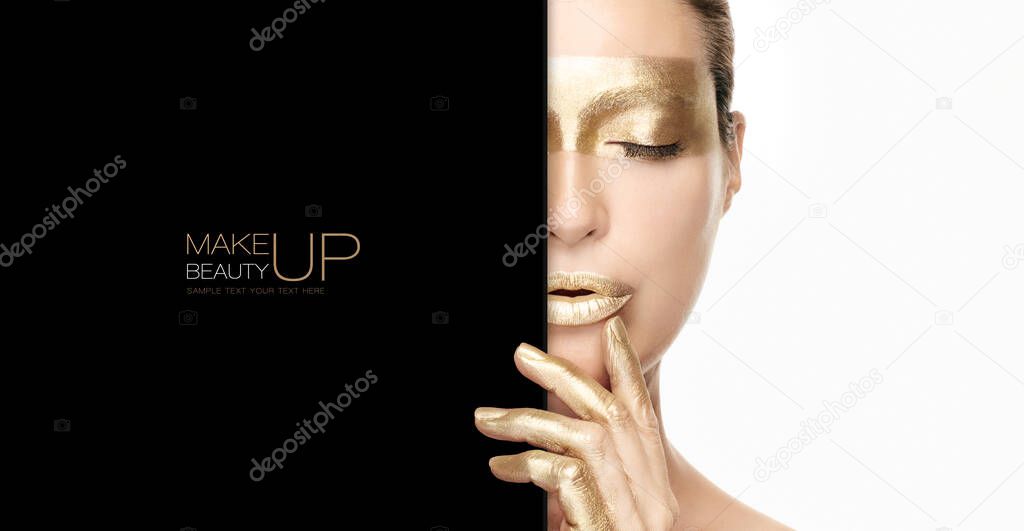 Gold beauty makeup and nail art concept with a half portrait of a woman wearing gold cosmetics on her eye, lips and fingers as she holds a black card to the side with copyspace in a panorama banner