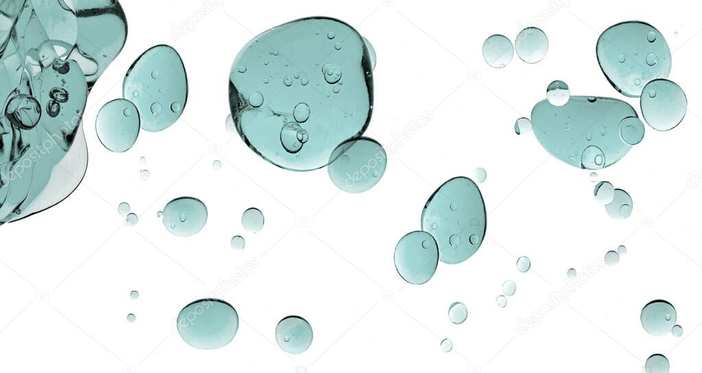 Liquid gel cosmetic texture. Greenish-blue gel drops. Close up of transparent cosmetic product isolated on white background.