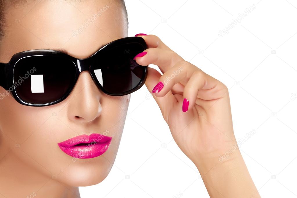 Beautiful Model in Black Fashion Sunglasses. Bright Makeup and M