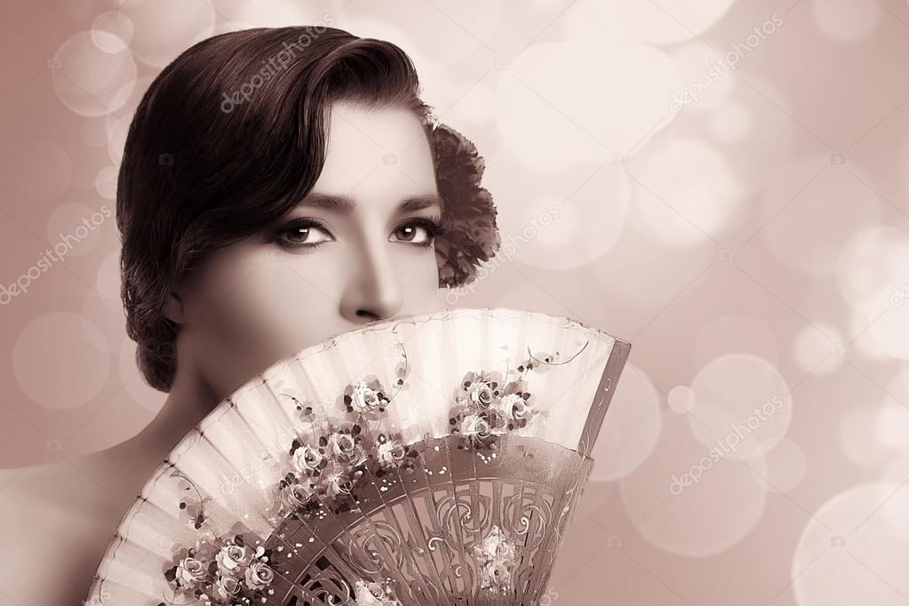 Gypsy Girl. Beauty Fashion Andalusian Woman with Stylish Fan