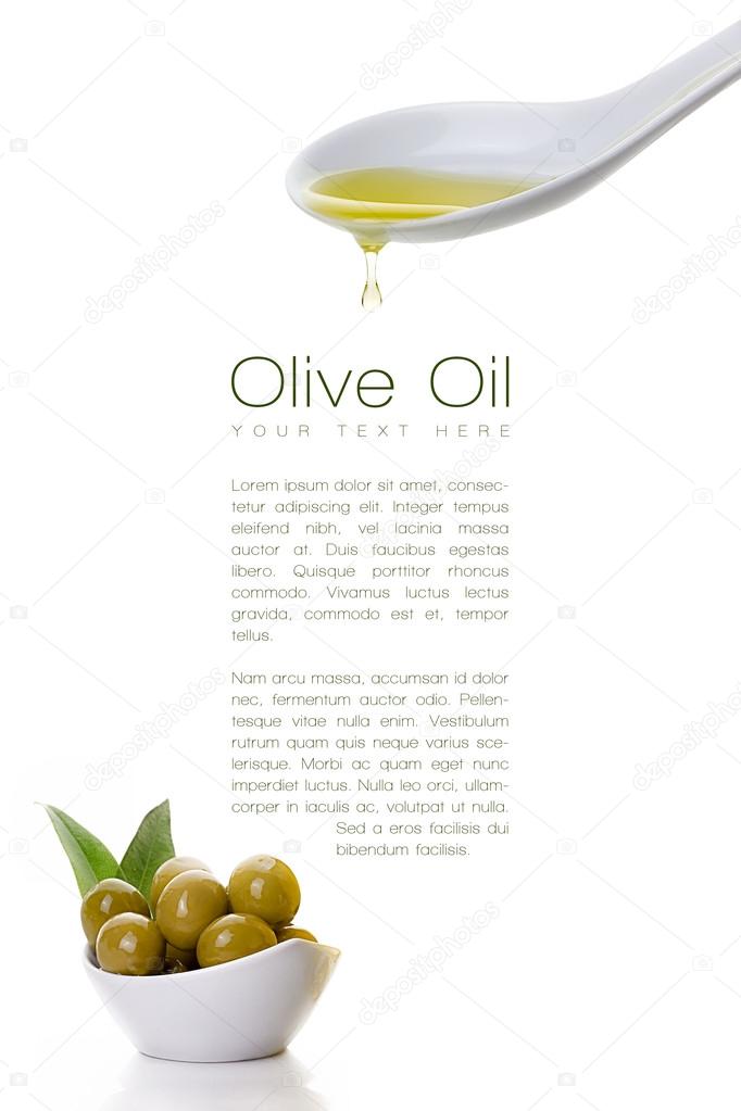 Virgin olive oil dripping from a spoon and olive seeds