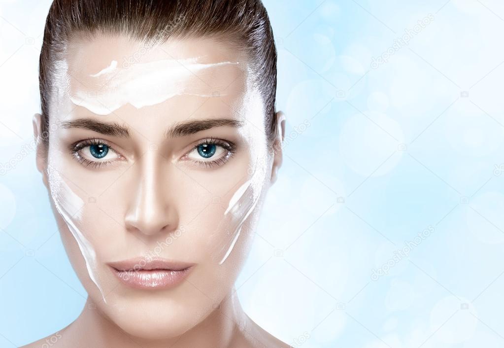 Beautiful Spa Girl with Cream on Her Face. Skincare concept