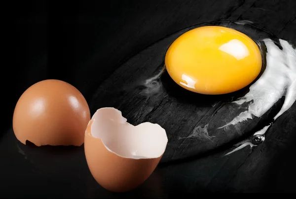 Raw Egg with Shell on Black Shale — Stock Photo, Image