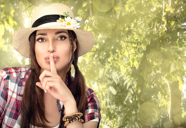 Beautiful Hipster Young Woman Hushing at Camera in the Garden — Stock Photo, Image