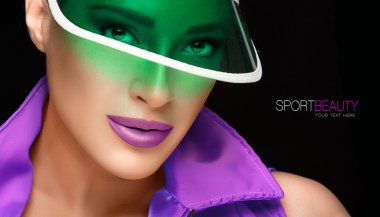 Sporty Woman in Green Sun Visor Looking at Camera clipart