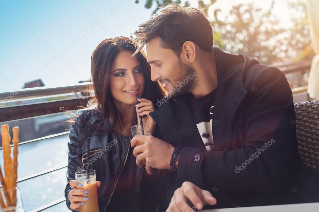 Loving couple in outdoor cafe