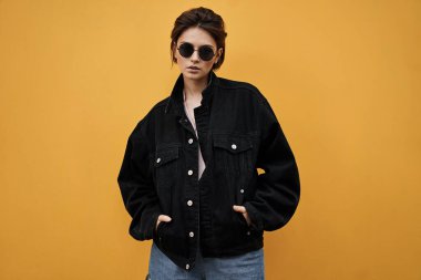 Vintage photo of young woman in sunglasses and black jacket  clipart