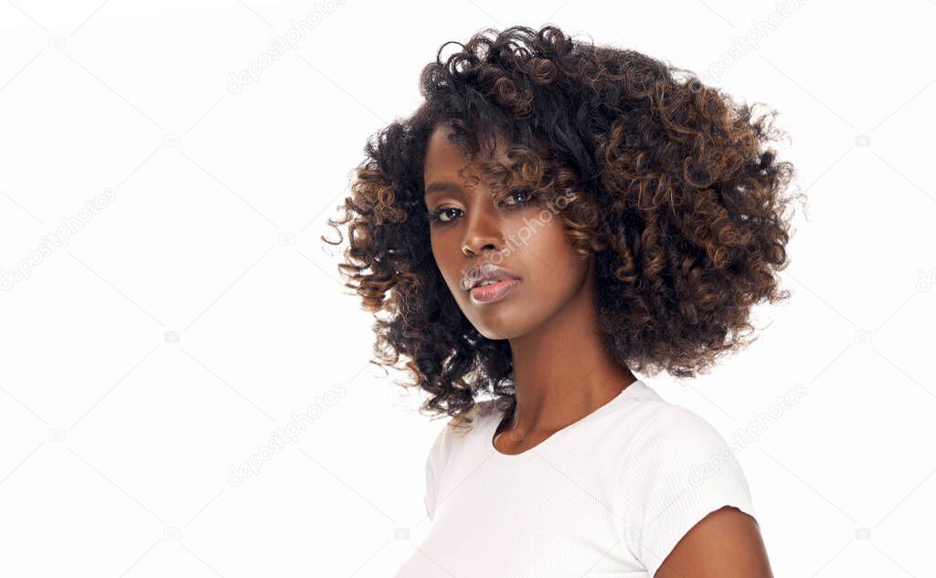 Portrait of young black woman with afro hair isolated on white background 