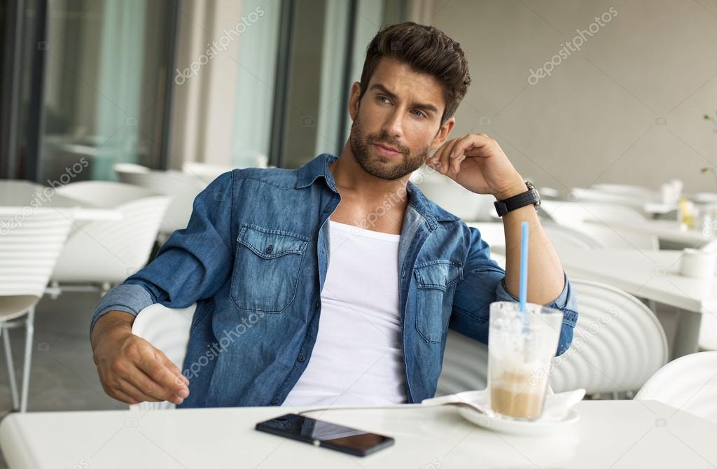 Young handsome man in cafe