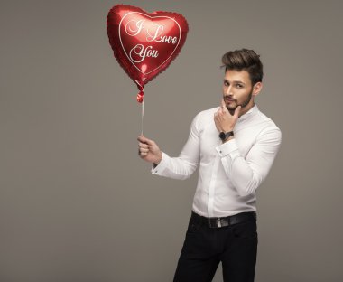 Handsome man with balloon thinking