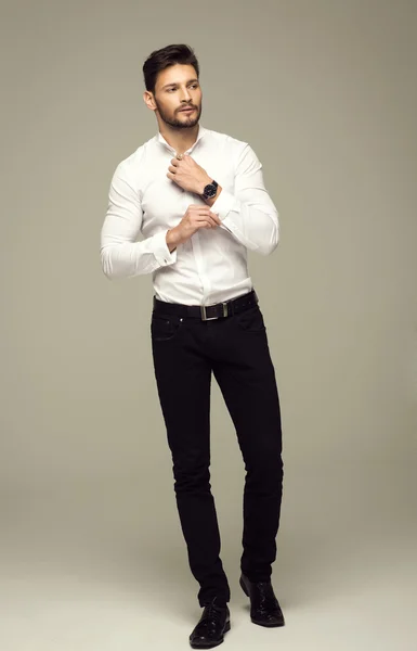 Handsome elegant man buttoning shirt — Stock Photo, Image