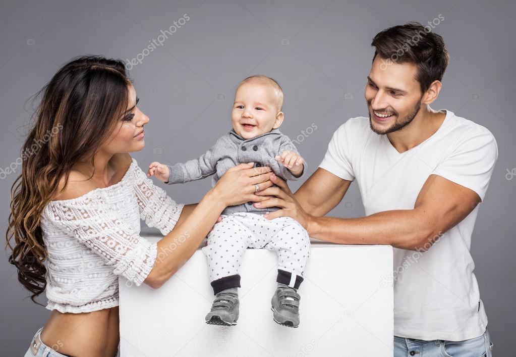Young parents with cute child