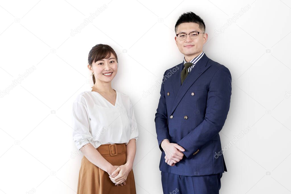 Asian business person standing with a smile