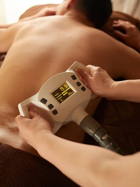Asian Man Receiving Mechanical Waist Massage — Stock Photo, Image