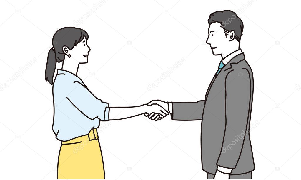 Male and female business people shaking hands