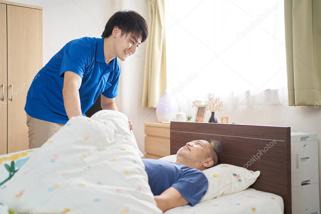 Male caregiver working in a care facility