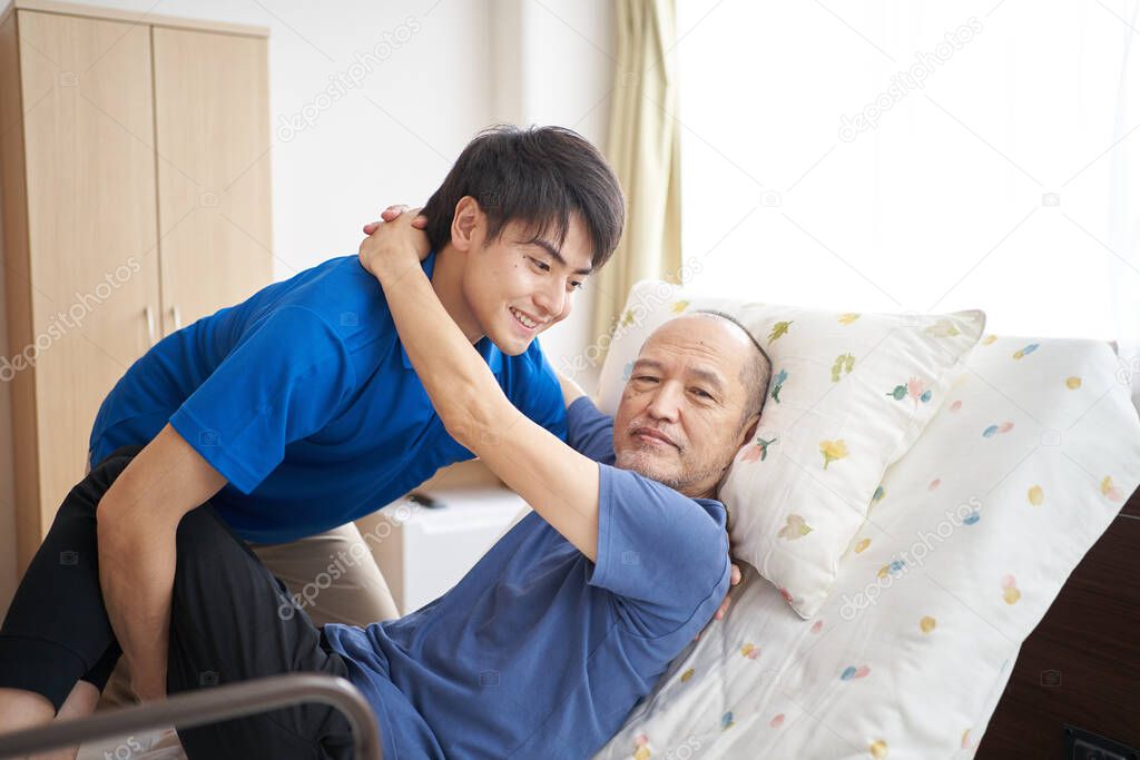Male caregiver with an elderly person