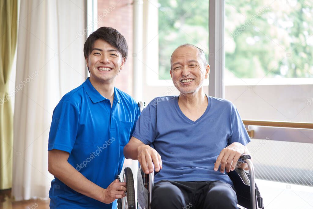 Wheelchair riding elderly and caregivers