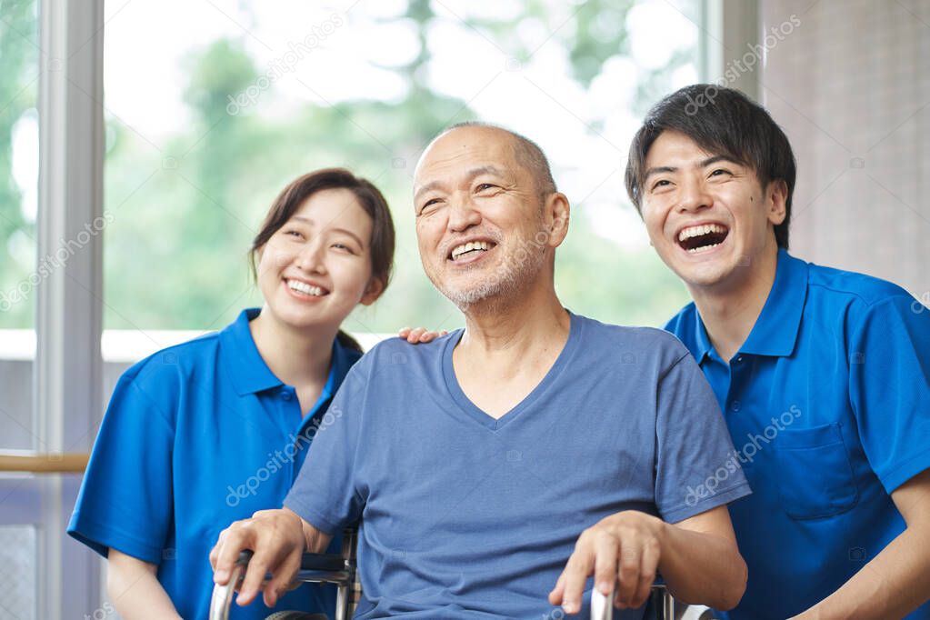 Asian Laughing Elderly and Caregivers