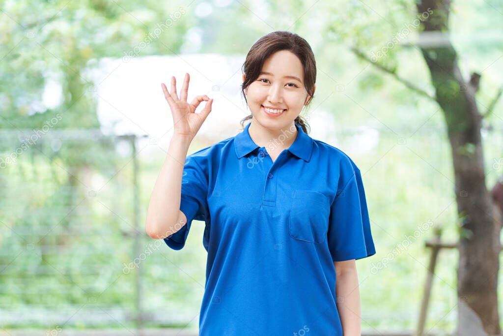 Female caregiver giving an OK sign