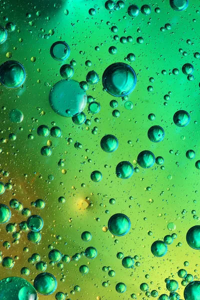 Oil Bubbles Water Glass Colored Background Stock Photo