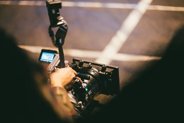 Professional film and video camera on the set. Shooting shift, equipment and group. Modern photography technique.