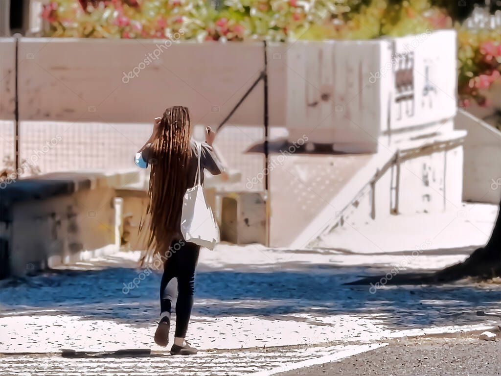 People walking through the city on a sunny day