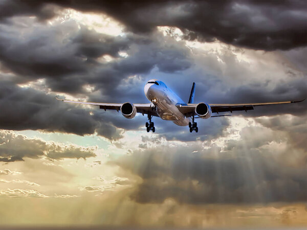 Plane preparing to land on a dramatic sky background