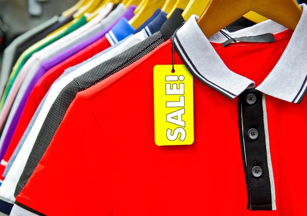 Clothes hanger with a man's shirts sale tag Stock Picture