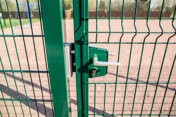 entrance to the playground of fence and the wicket of the welded