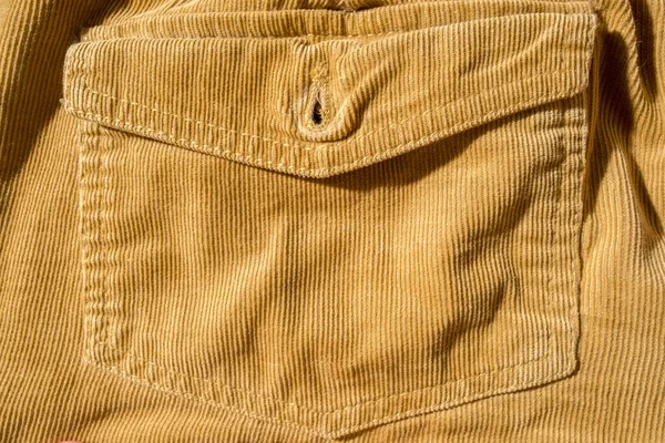 Trouser pocket, close-up. Corduroy yellow texture. Copy space. Beautiful background. — Stok fotoğraf