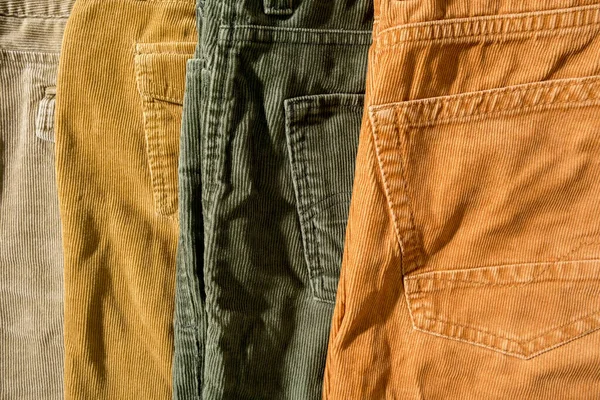 Neatly folded corduroy trousers, on sale. Shopping. — Fotografia de Stock