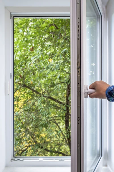 Man opens pvc window — Stock Photo, Image