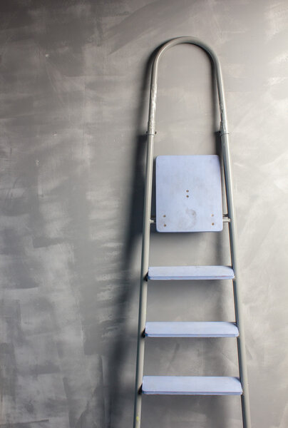 repair in an apartment by using a stepladder