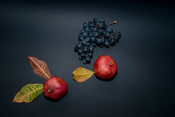 Bunch Grapes Ripe Pomegranate Black Background Still Life Fruits — Stock Photo, Image