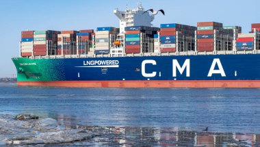 The LNG-powered containership, the CMA CGM Louvre, on the river Elbe near the city of Hamburg, Germany. Ship is leaving the port of Hamburg on Sunday the 14th of February 2021.	
