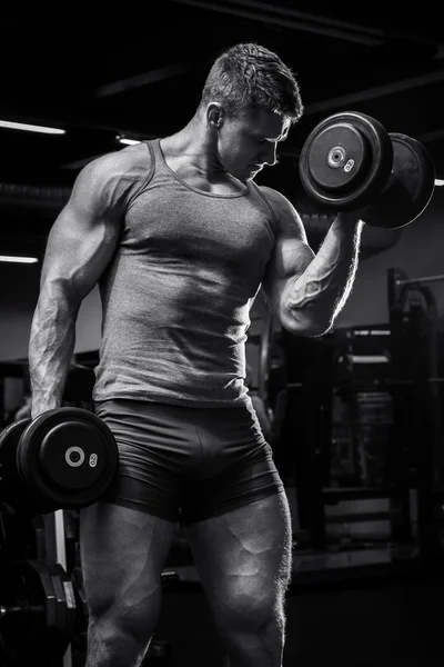 Muscular man with dumbbells — Stock Photo, Image