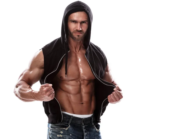 Muscular man posing in hoodie — Stock Photo, Image