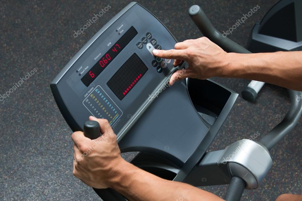 Arms on panel of cardio machine — Stock Photo © AY_PHOTO 106321662