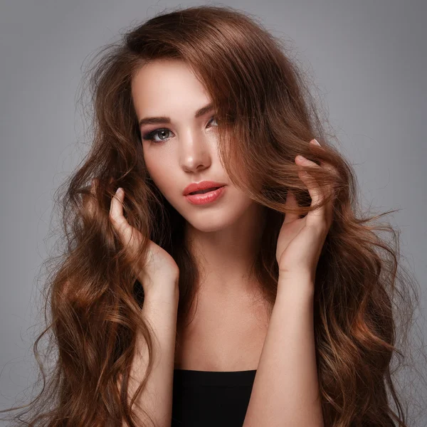 Woman with long curly hair — Stock Photo, Image