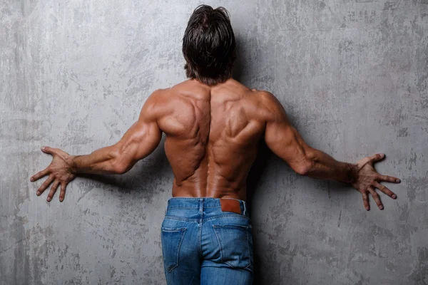 Muscular man in jeans — Stock Photo, Image