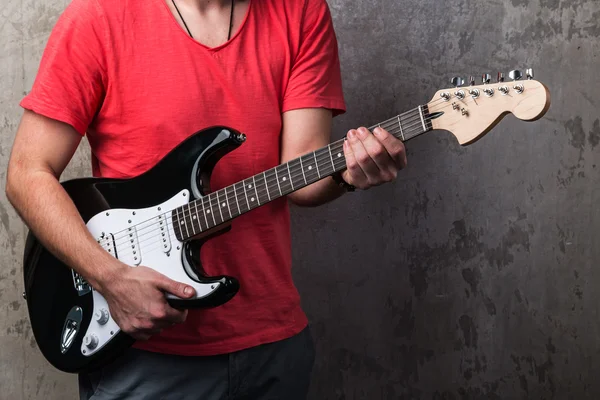 Guy in red shirt with electric guitar — Stock Photo, Image