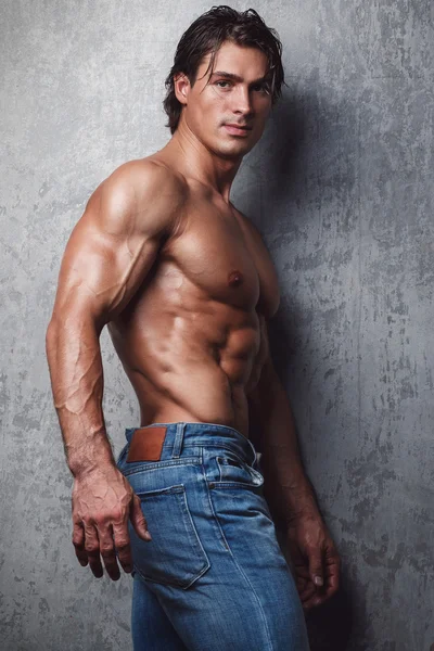 Muscular man in jeans Stock Picture