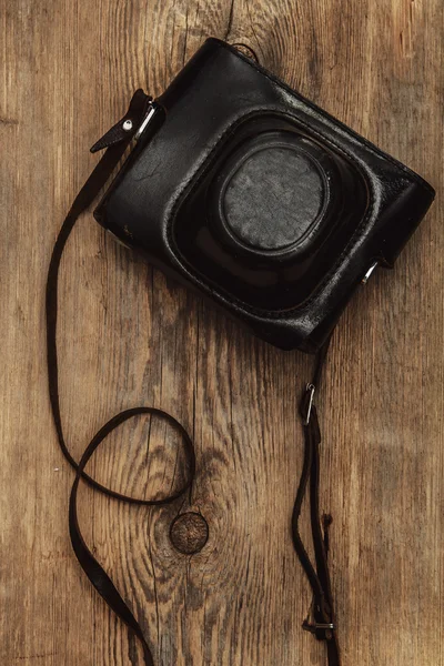 Retro camera in leather case — Stock Photo, Image