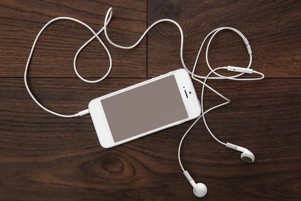 Smart phone and earphones — Stock Photo, Image