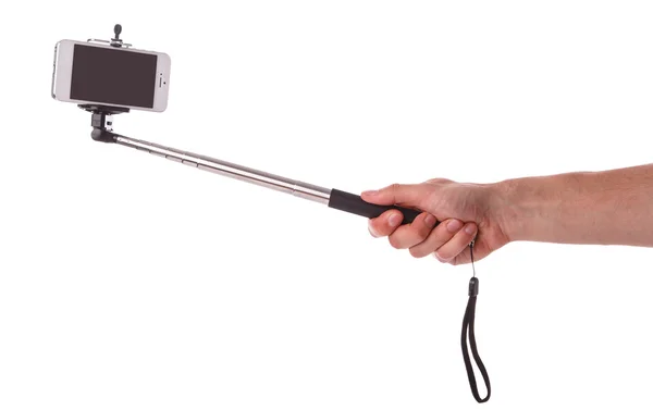 Telefone inteligente em uma vara de selfie — Fotografia de Stock