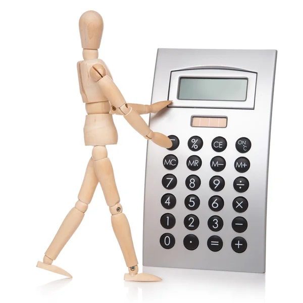 Small wooden dummy and calculator — Stock Photo, Image